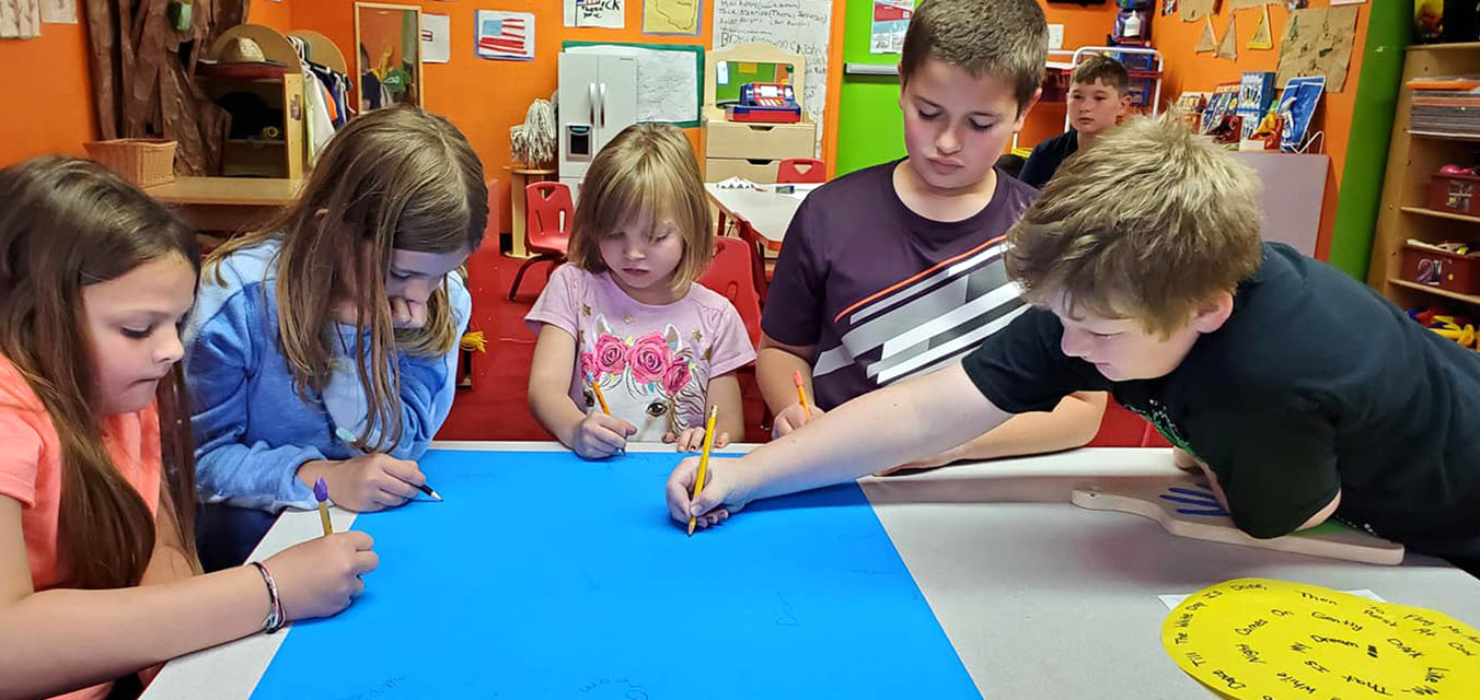 Children drawing at Robin's Nest Learning Center in Carterville, Illinois